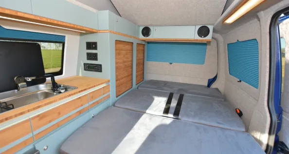 The Out and About Campers rising roof campervan bed